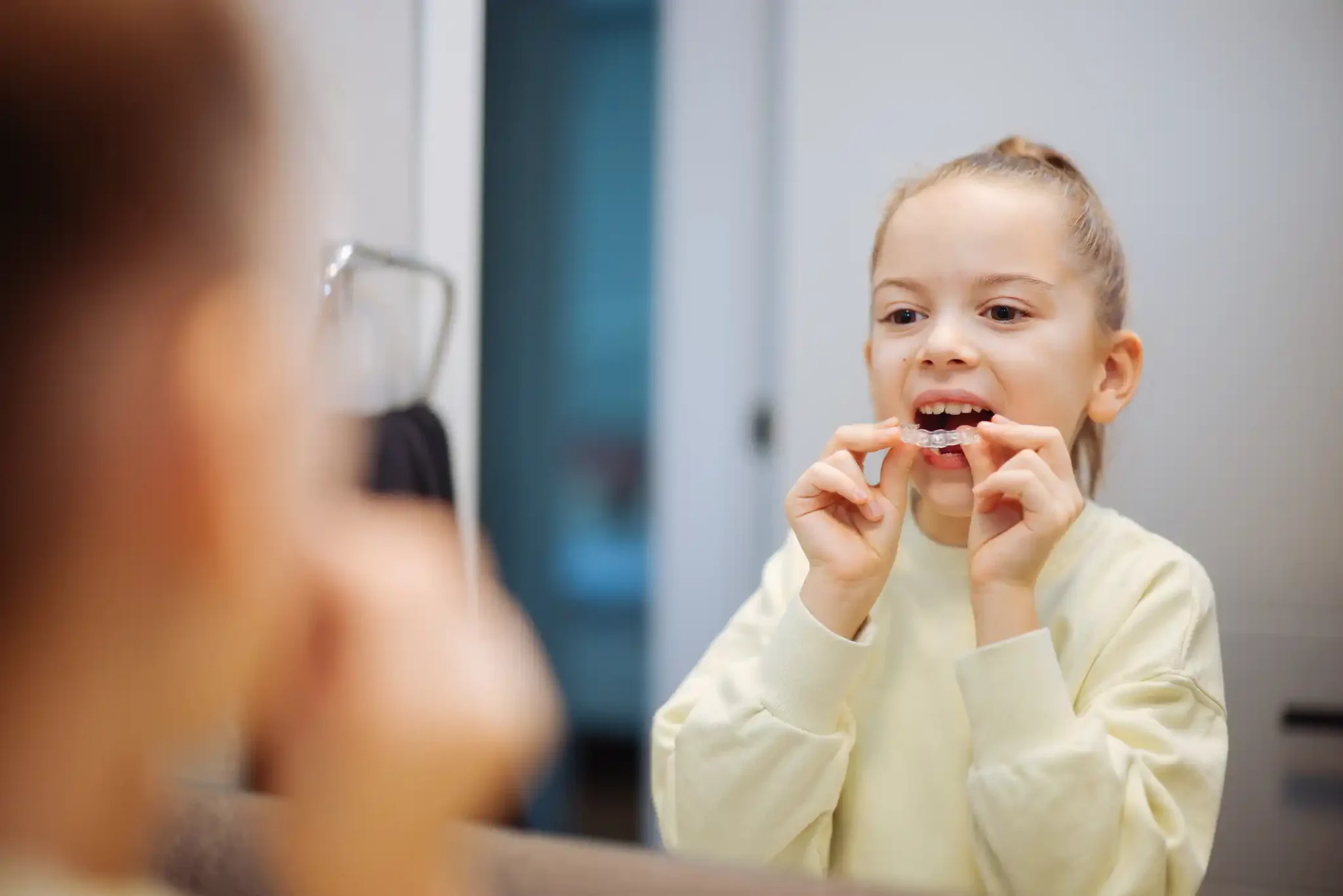 kid with clear aligners